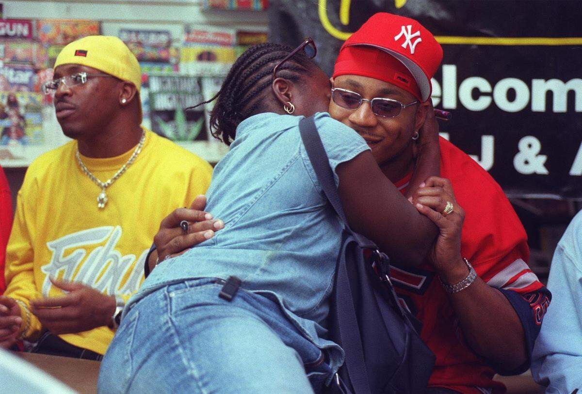 1999. A fan kisses LL Cool J during an in-store at Manifest.