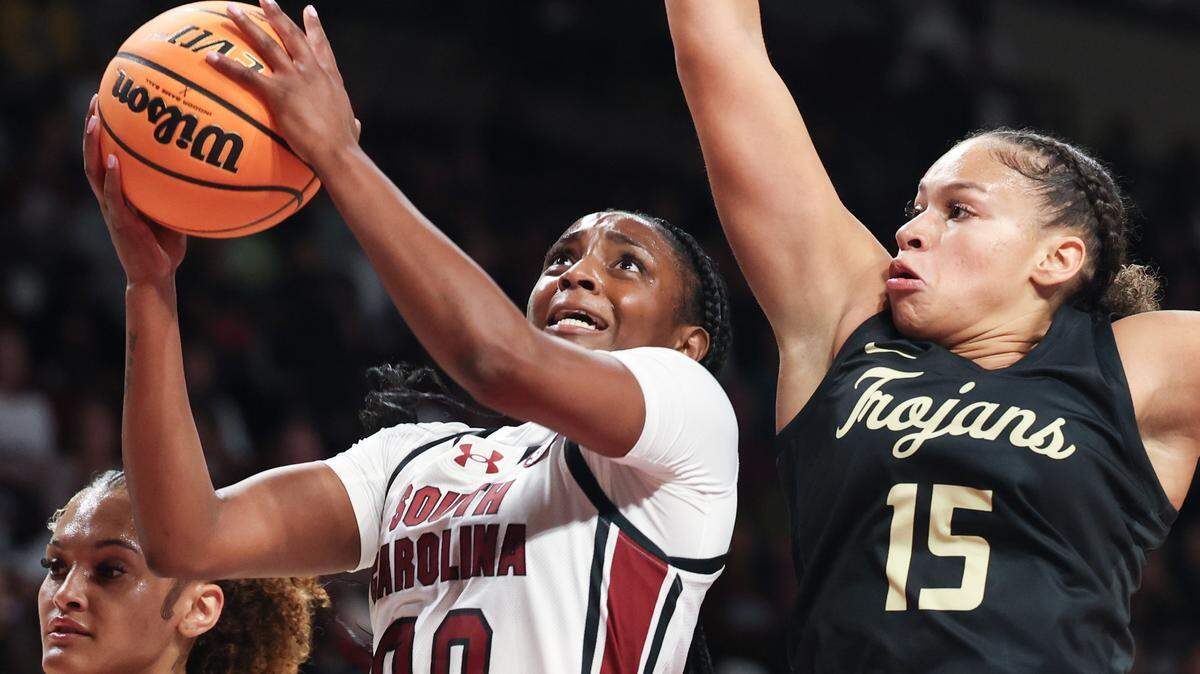 University of South Carolina's Ta'Niya Latson (00) drives to the basket as Anderson's Rose Gravel (15) pressures during the first half of action at the Colonial Life Arena on Friday Oct. 24, 2025.