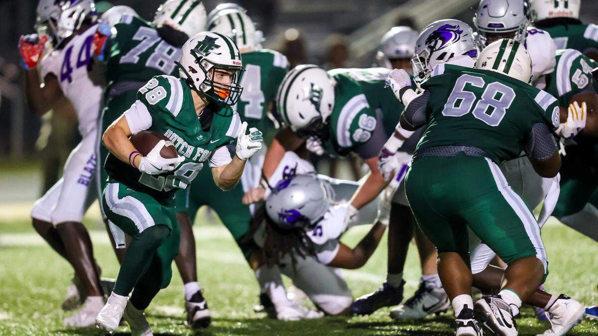 Dutch Fork Silver Foxes running back Kyle Henry (28) rushes against the Ridge View Blazers during their game at Dutch Fork High School, Friday, 9/5/25.