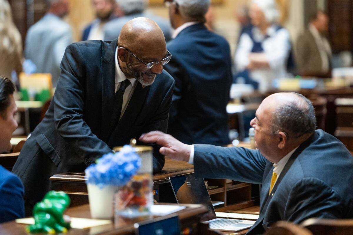 State Rep. Robert Williams, D-Darlington, speaks with state Rep. Bill Hager, R-Hampton, before the House debates redistricting on Friday, May 15, 2026.