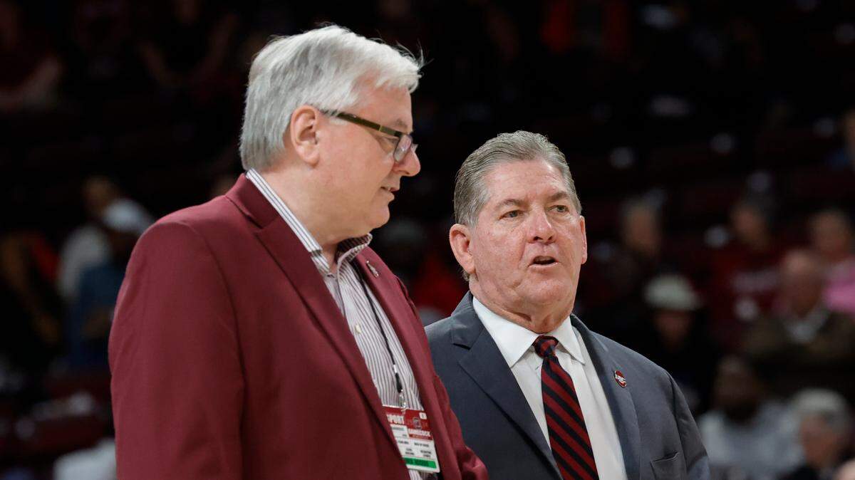 University of South Carolina President Michael Amiridis and Athletic Director Ray Tanner walk on court for senior day honors before the women’s basketball game against Tennessee in the Colonial Life Arena on Sunday, Mar. 3, 2024