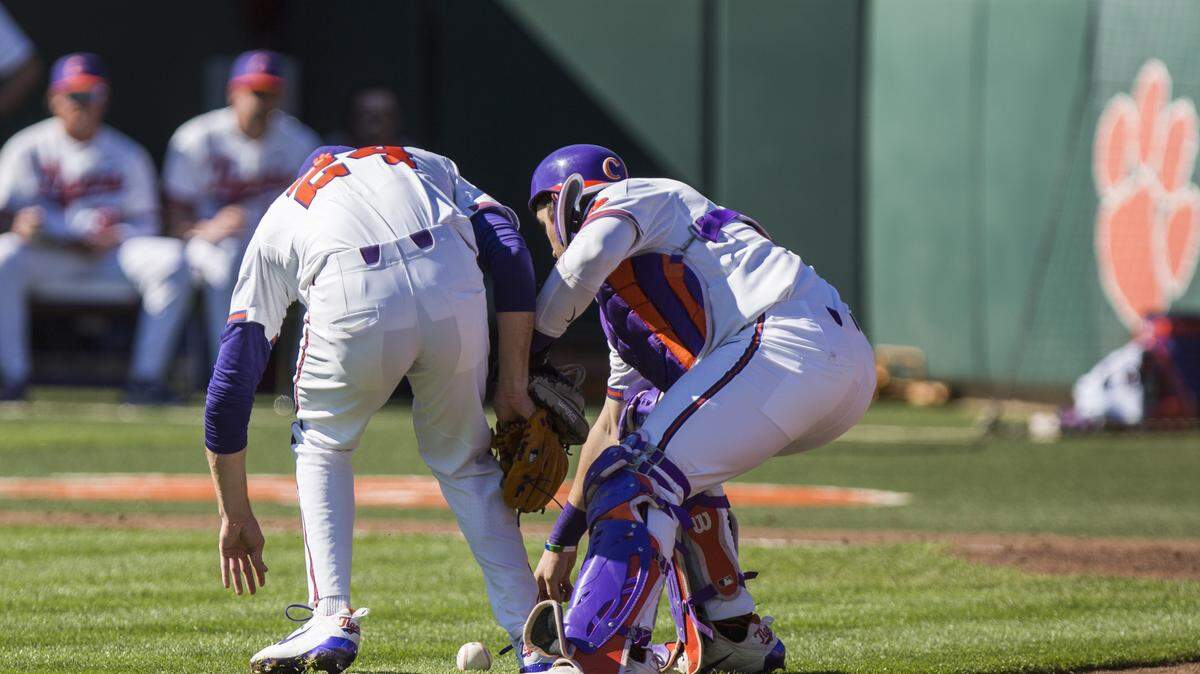 Clemson's Kyle Wilkie (right) had an RBI single Saturday against N.C. State.