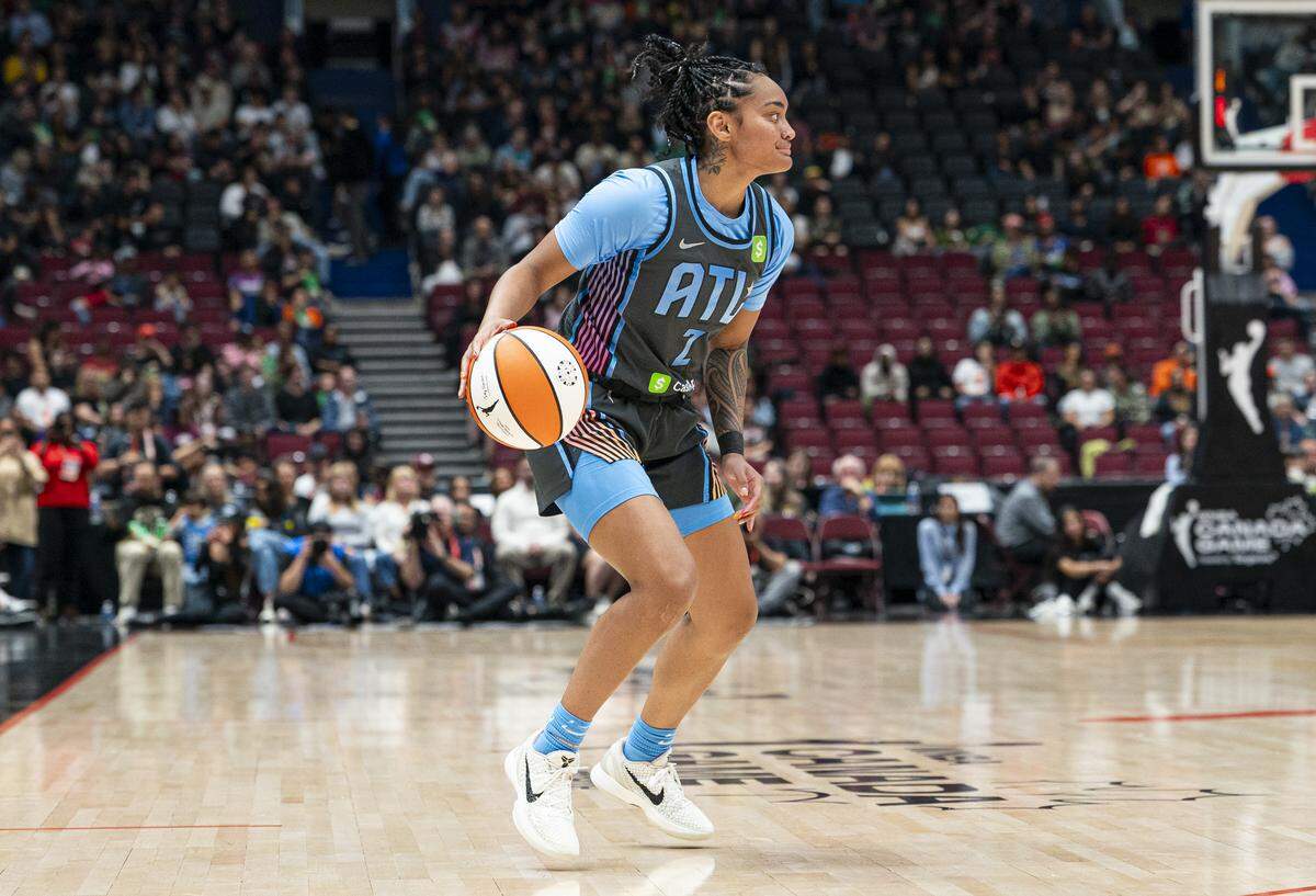 Te-Hina Paopao #2 of the Atlanta Dream dribbles the ball during WNBA action in August against the Seattle Storm.
