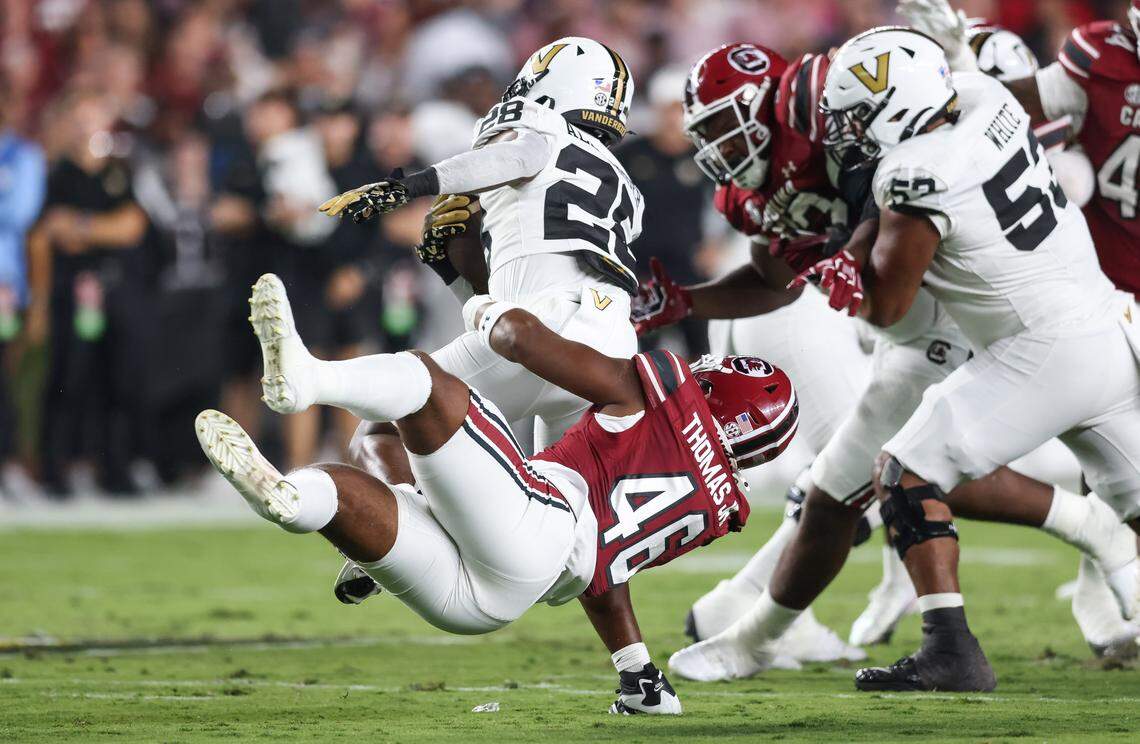 South Carolina linebacker Bryan Thomas Jr. (46) wraps up Vanderbilt running back Sedrick Alexander (28) during the first half of the Gamecocks’ game against Vanderbilt at Williams-Brice Stadium in Columbia on Saturday, September 13, 2025.