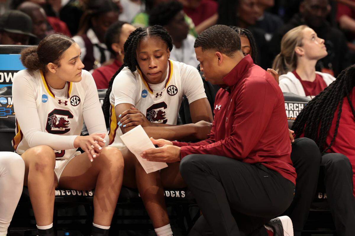 Winston Gandy, then a USC assistant, talks with Joyce Edwards (8) during the second half of action in the Second Round game of the NCAA Tournament at the Colonial Life Arena on March 23, 2025.