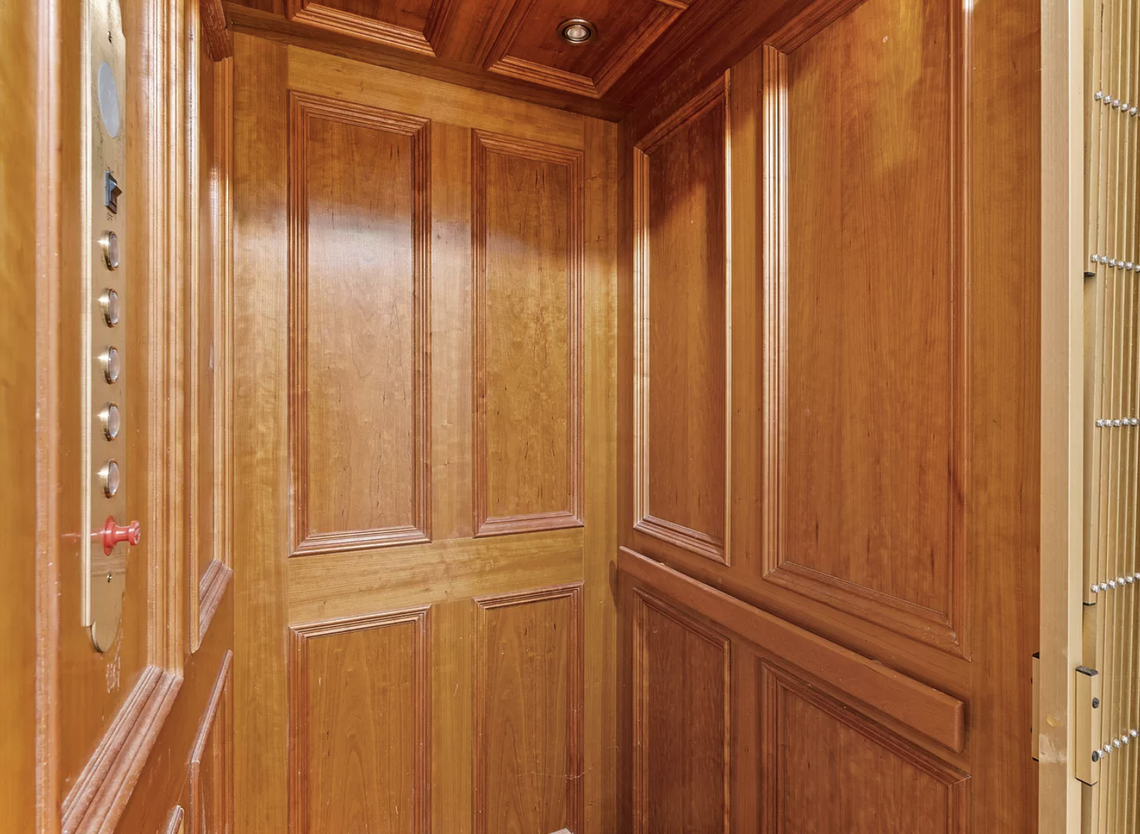 The house has an elevator that goes to all four floors and the roof.