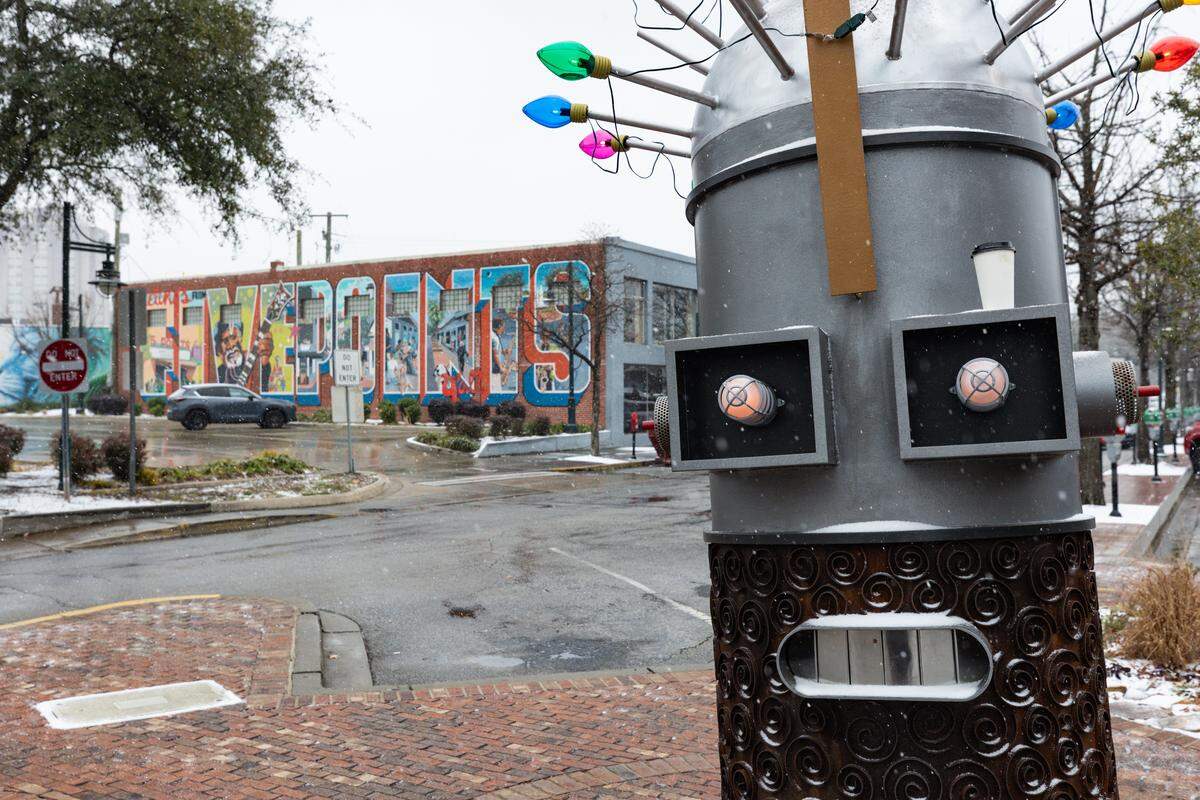 Wet snow, accumulating in heavy granules, blankets Five Points in Columbia, South Carolina on Saturday, January 31, 2026.