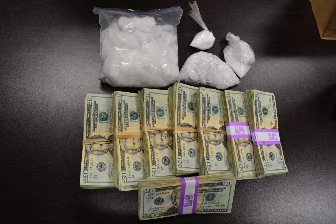 Drugs and cash were seized by police.