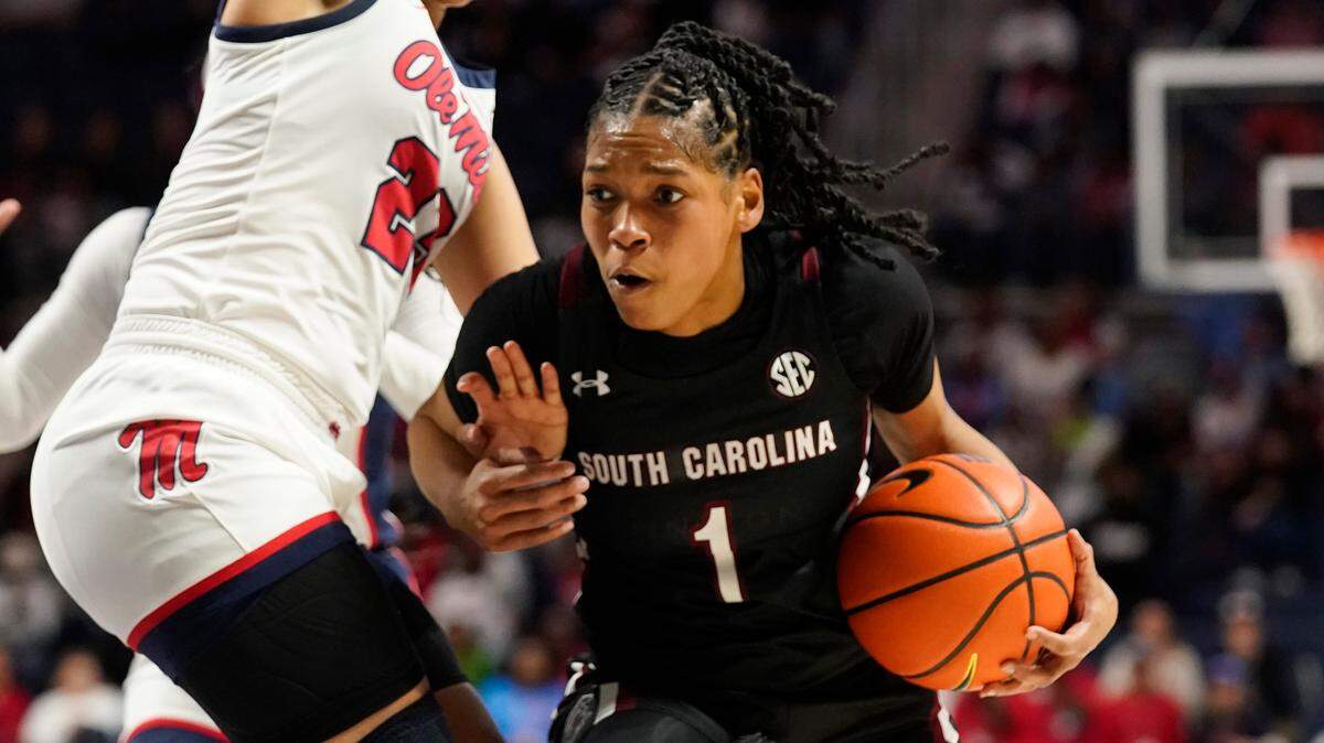 South Carolina guard Zia Cooke (1) drives against Mississippi guard Elauna Eaton (23) during the first half of an NCAA college basketball game in Oxford, Miss., Sunday, Feb. 19, 2023. (AP Photo/Rogelio V. Solis)