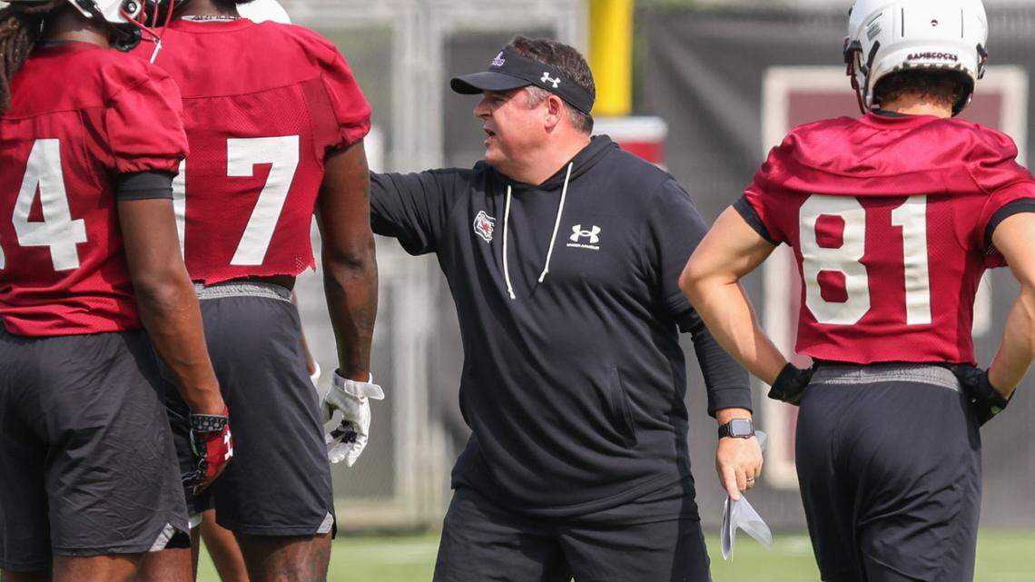 South Carolina offensive coordinator Dowell Loggains works with his players during the first day of practice in Columbia on Friday, August 4, 2023.