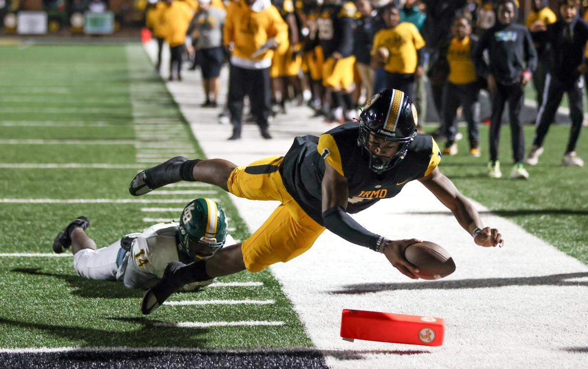 Aaron Brand (1) of Irmo breaks the tackle of Demar Cross (14) of Myrtle Beach for a touchdown during the Yellowjackets’ game against the visiting Seahawks in Irmo on Friday, November 10, 2023.
