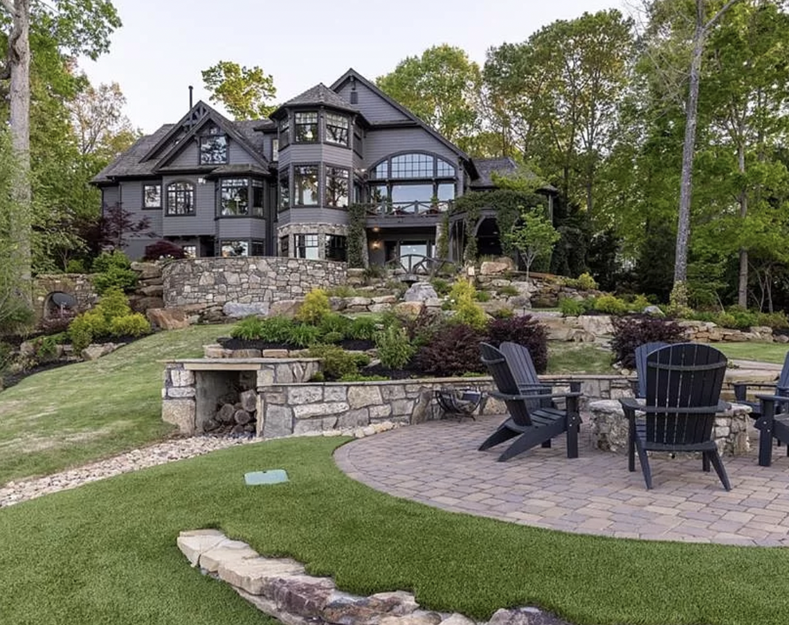 This 8,000-square foot house on Wynward Pointe Drive in Salem has six bedrooms, a bunk room, six and a half baths, a putting green and theater.