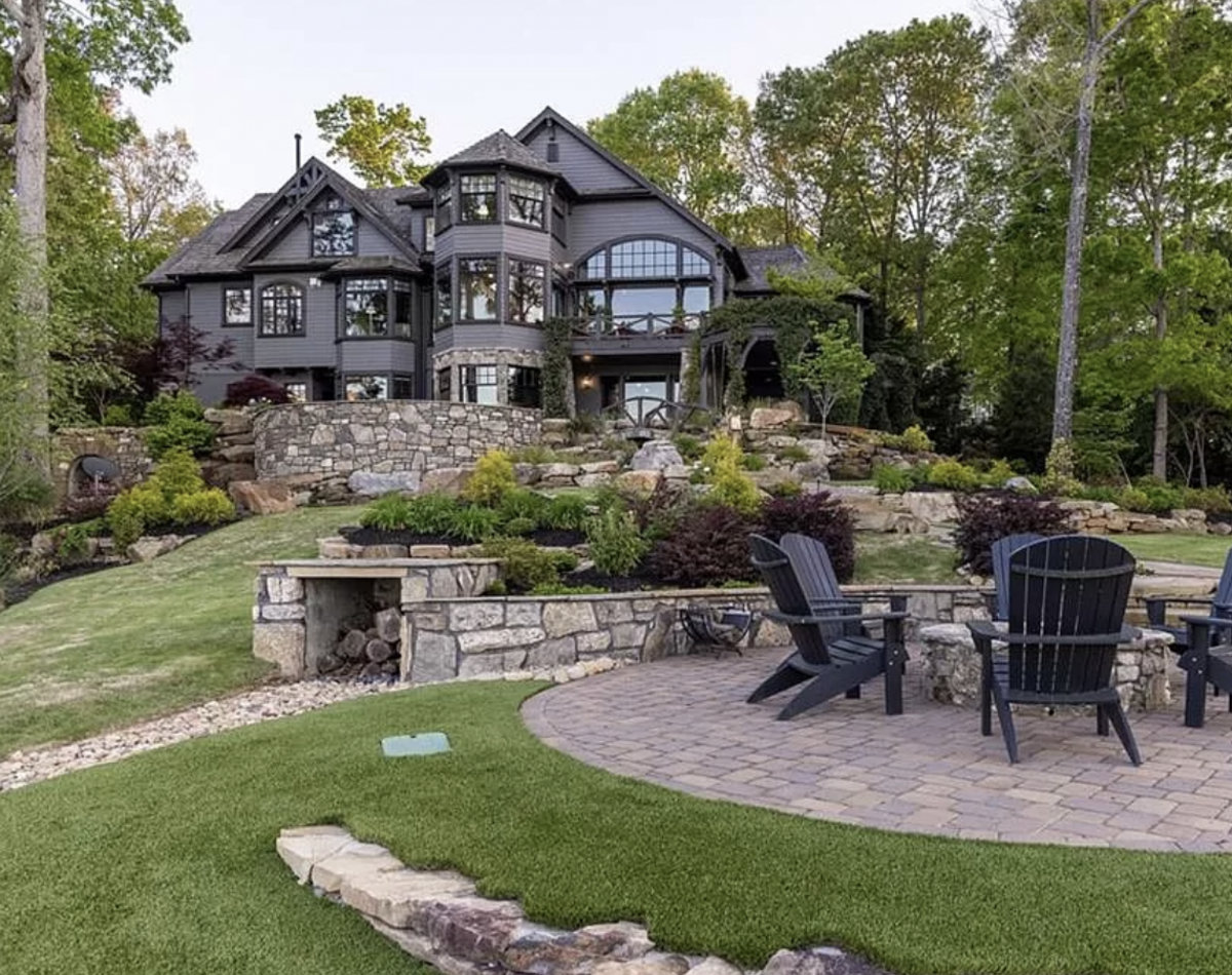 This 8,000-square foot house on Wynward Pointe Drive in Salem has six bedrooms, a bunk room, six and a half baths, a putting green and theater.