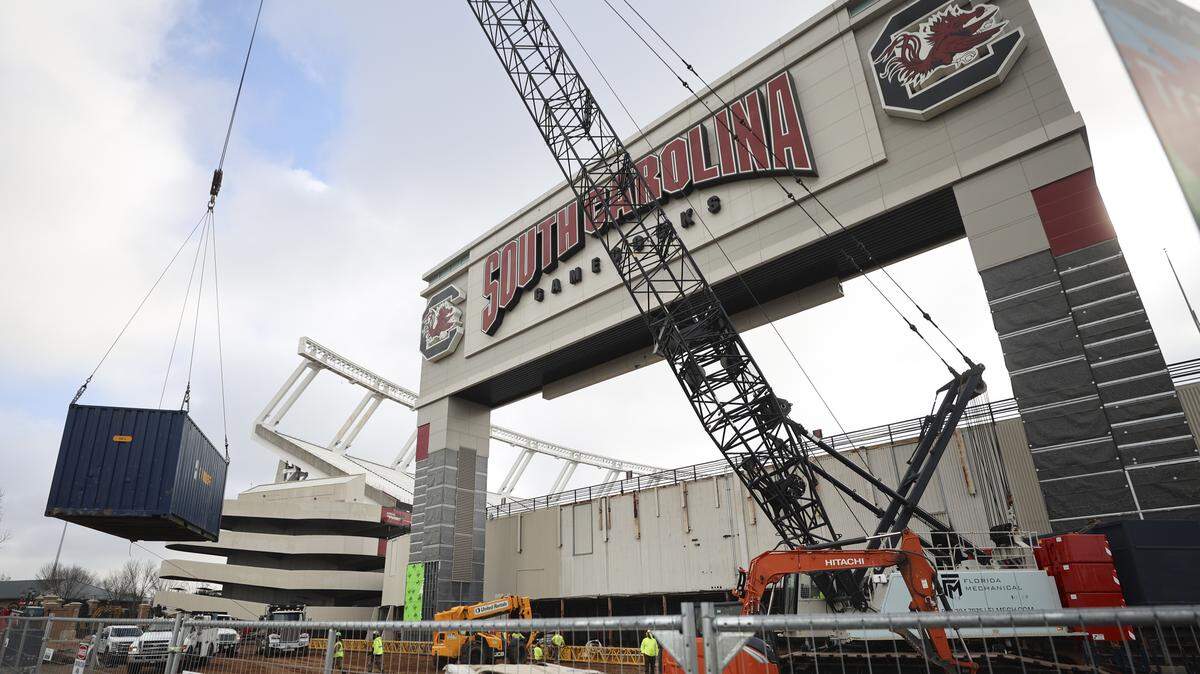 Crews work to demolish portions of Williams-Brice Stadium on Wednesday. The Floyd Building, which used to sit under the scoreboard, is gone and will be replaced by a club space for students.
