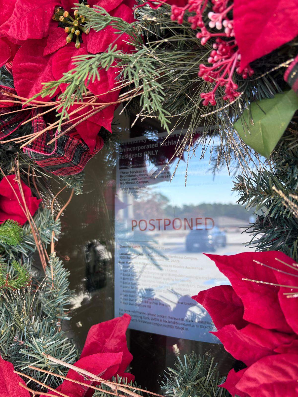 A financial assistance outreach event had been scheduled for Dec. 10 and 11 at Brookland Baptist Northeast church, but it was canceled on short notice when the money for the assistance program fell through. A flyer was posted to the door of the church Wednesday, hidden behind large Christmas wreaths.