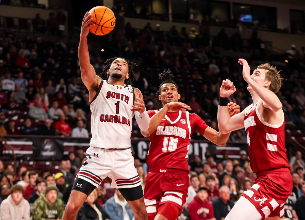South Carolina Gamecocks guard Jacobi Wright (1) drives around Alabama Crimson Tide forward Jarin Stevenson (15) in the first half at Colonial Life Arena.