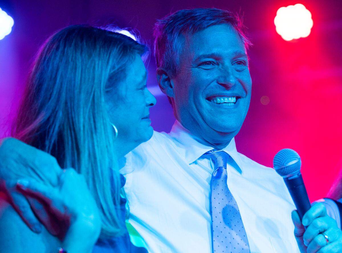 Daniel Rickenmann celebrates with his wife, Laura, after being elected Columbia mayor in a runoff on Tuesday, Nov. 16, runoff.