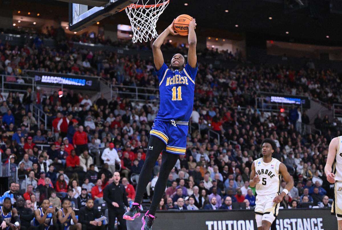 Mar 22, 2025; Providence, RI, USA; McNeese State Cowboys guard Quadir Copeland (11) dunks during the second half of a second round men’s NCAA Tournament game against the Purdue Boilermakers at Amica Mutual Pavilion.