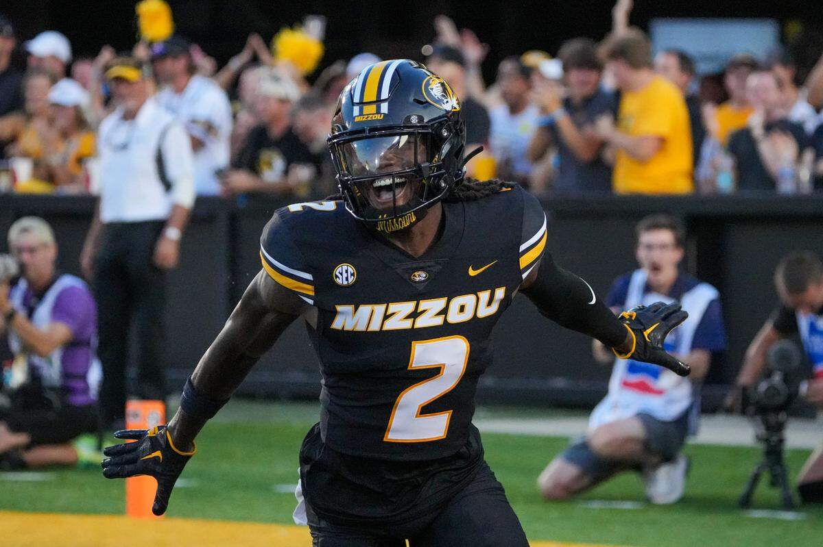 Aug 29, 2024; Columbia, Missouri, USA; Missouri Tigers cornerback Toriano Pride Jr. (2) celebrates after scoring against the Murray State Racers on a pick six during the first half at Faurot Field at Memorial Stadium.