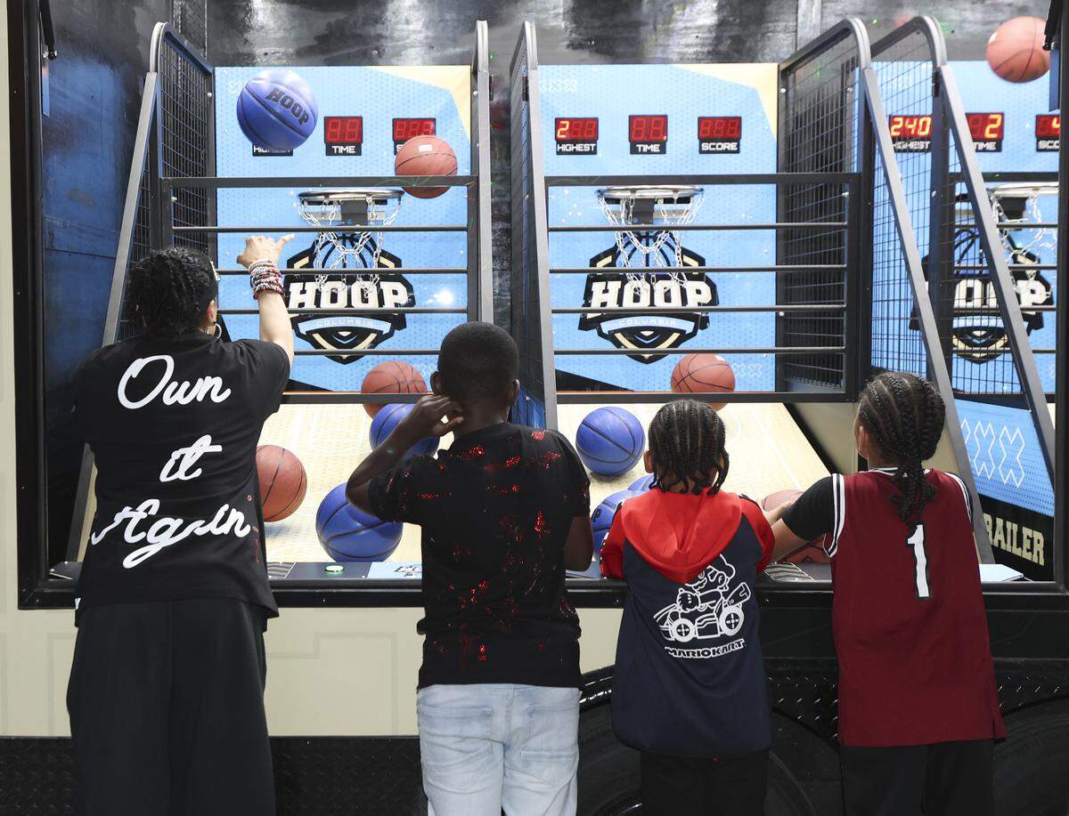 South Carolina's head coach Dawn Staley plays an electronic basketball game during a watch party for the Gamecocks women’s basketball team at the Columbia Museum of Art on Sunday, March 15, 2026.