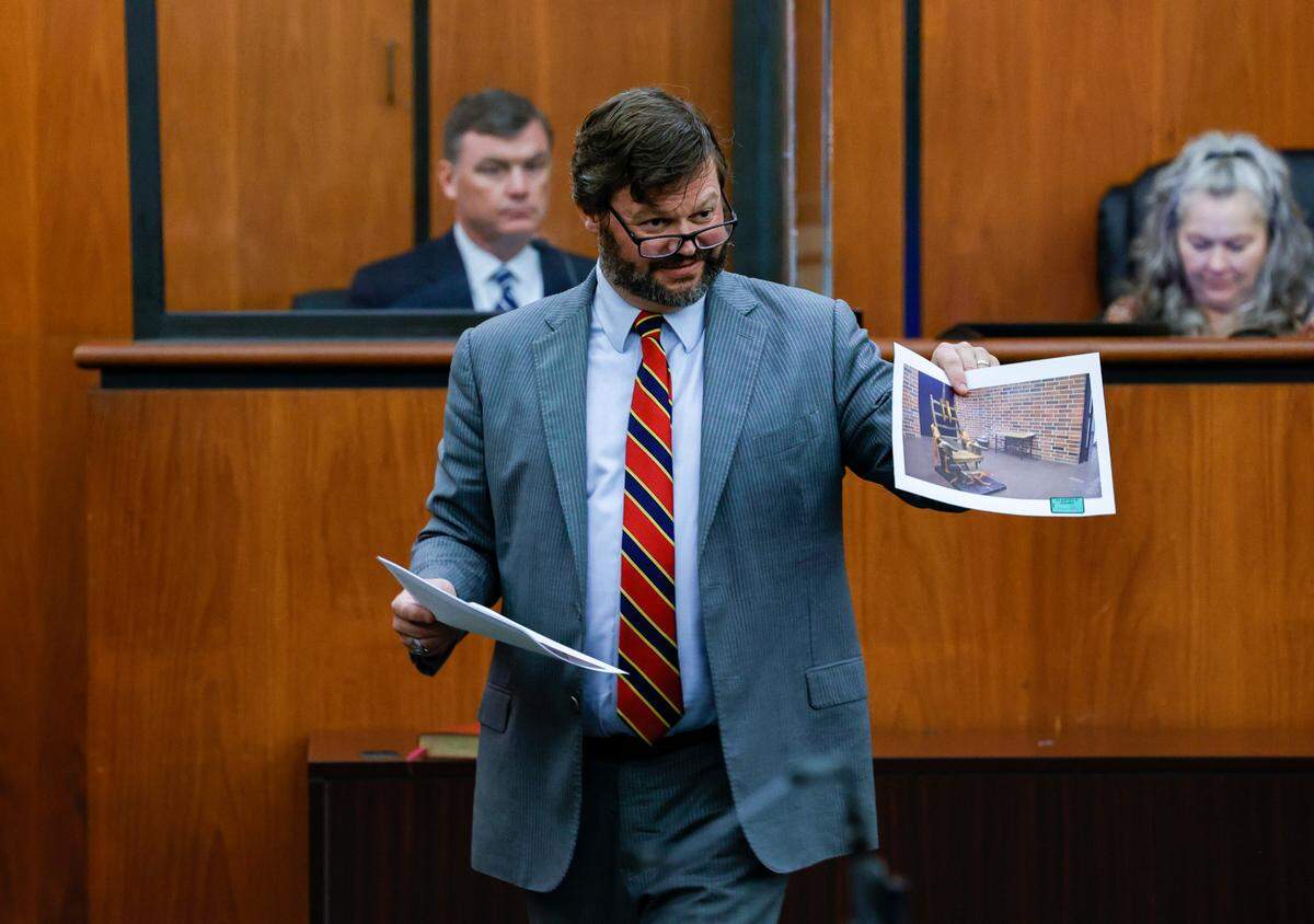 Attorney Josh Kendrick shows a picture of South Carolina’s electric chair as he questions South Carolina Department of Corrections Director Bryan Stirling during a trial concerning the constitutionality of South Carolina execution laws, on Tuesday, August, 2, 2022 in the Richland County Courthouse.