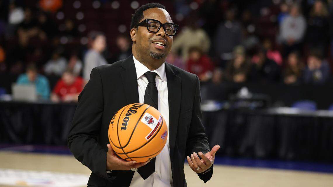 Head coach Dion Bethea of Gray Collegiate is given a ball after Gray Collegiate’s win over Oceanside Collegiate in the SCHSL 2A Boys Basketball State Final at the Florence Center on Friday, March 1, 2024.