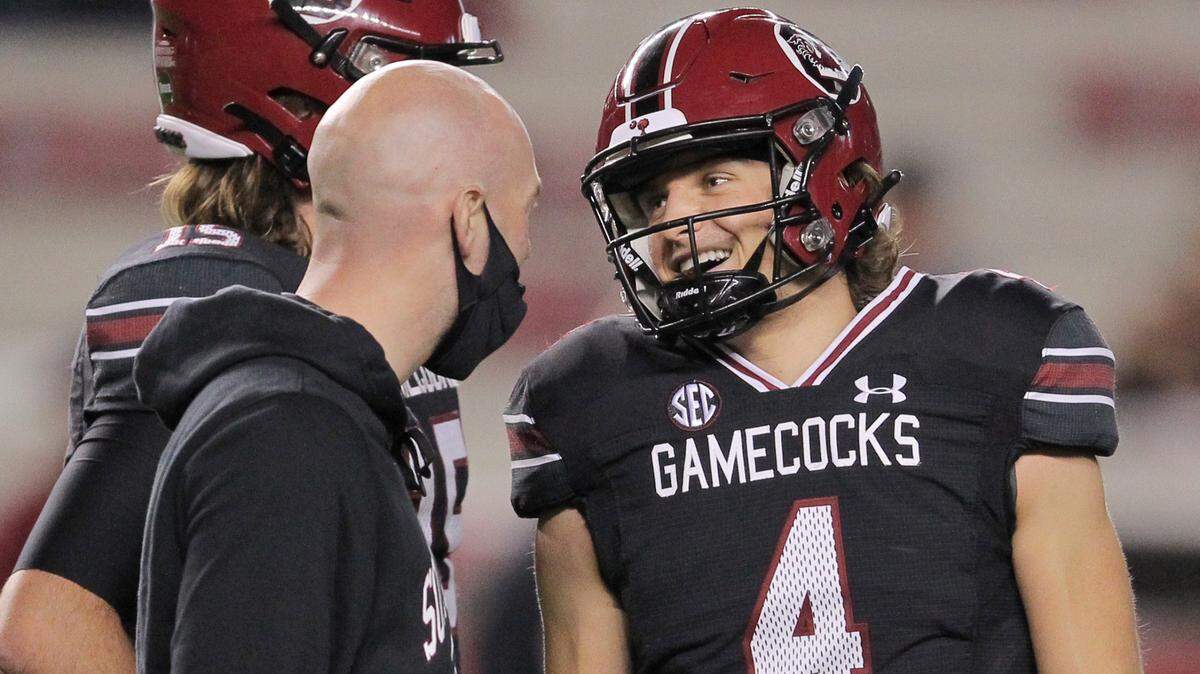 South Carolina quarterback Luke Doty shares a laugh with quarterbacks coach Connor Shaw before the Missouri game on Saturday Nov. 21, 2020 in Columbia, S.C.