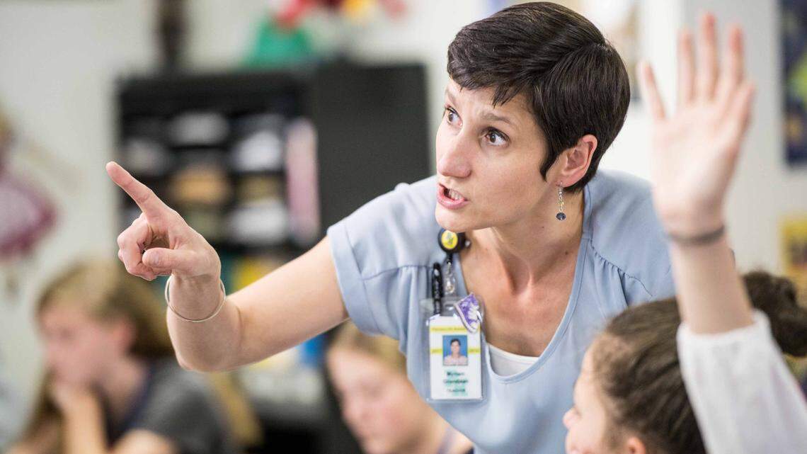 Myriam Grandjean helps students during German class at Pleasant Hill Middle School Friday, April 27, 2018, in Lexington, S.C. Grandjean is a cultural exchange teacher with a limited visa that expires this year.