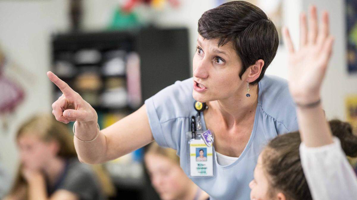 Myriam Grandjean helps students during German class at Pleasant Hill Middle School Friday, April 27, 2018, in Lexington, S.C. Grandjean is a cultural exchange teacher with a limited visa that expires this year.
