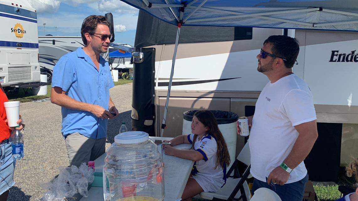 Democratic nominee for governor Joe Cunningham speaks to Jay Colbertson, a Republican from Georgetown, at the Darlington Raceway before the Southern 500 on Sept. 4, 2022.