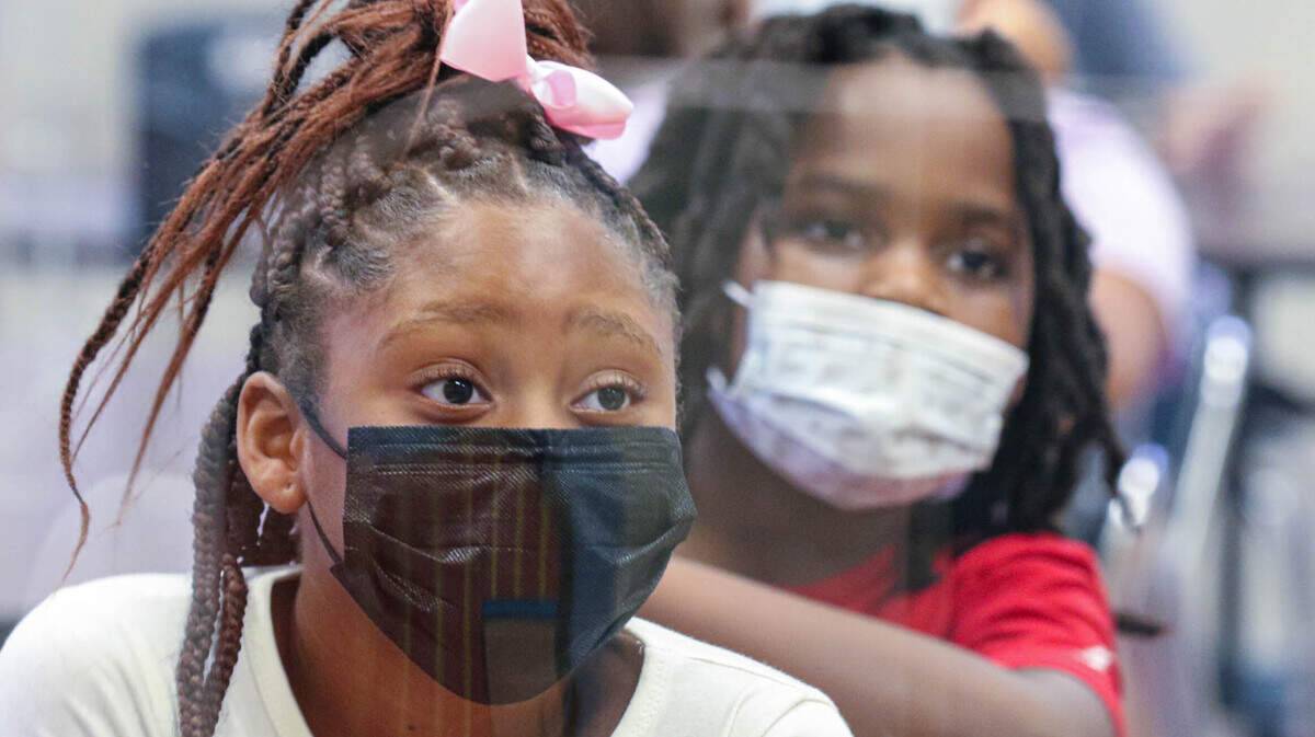 Kalani Scales-Inabinet, foreground, and Andre Saxon attend Spanish class on Wednesday, Aug. 18, 2021, the first day of school at A.C. Moore Elementary School.
