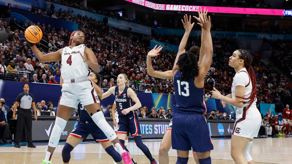 South Carolina’s Aliyah Boston (4) pulls down a rebound during the first half of the national championship game against UConn at the Target Center in Minneapolis, Minn. on Sunday April 3, 2022.