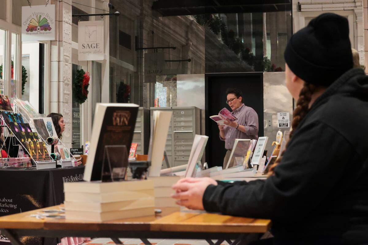 Baker Rogers reads from their book during a book and poetry reading at Queer Haven Books in Columbia. The independent bookstore specializing in LGBTQ+ books and gifts opened in the Arcade Building in April, 2024.