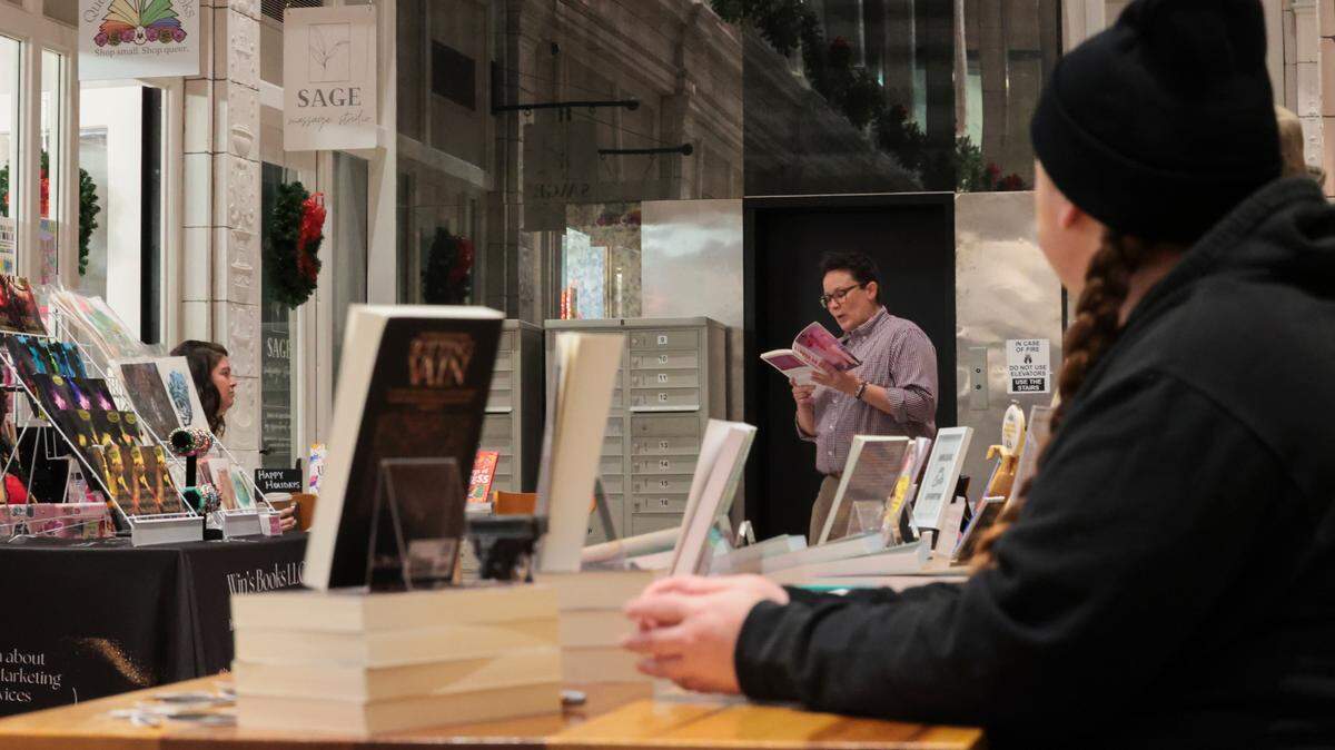 Baker Rogers reads from their book during a 2024 book and poetry reading at Queer Haven Books in Columbia.