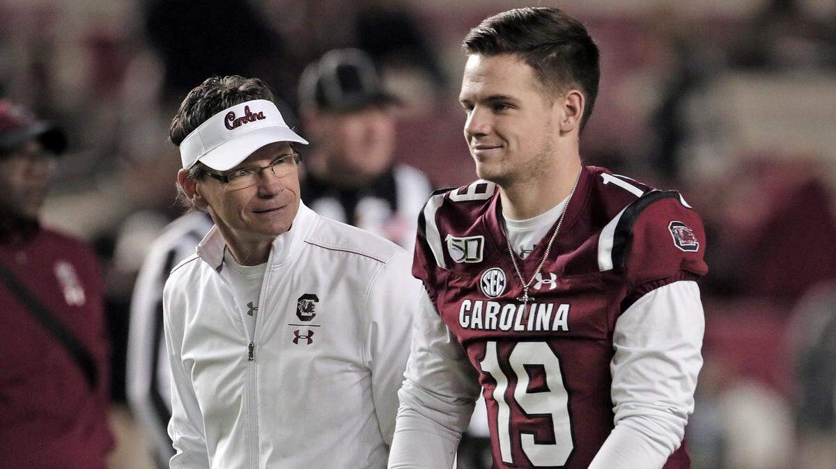 South Carolina football’s Jake Bentley speaks with dad Bobby before the 2019 Vanderbilt game.