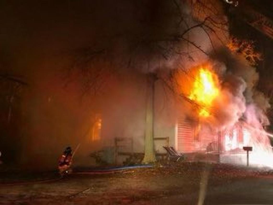 Fire fighters battle a burning building in Lexington County.
