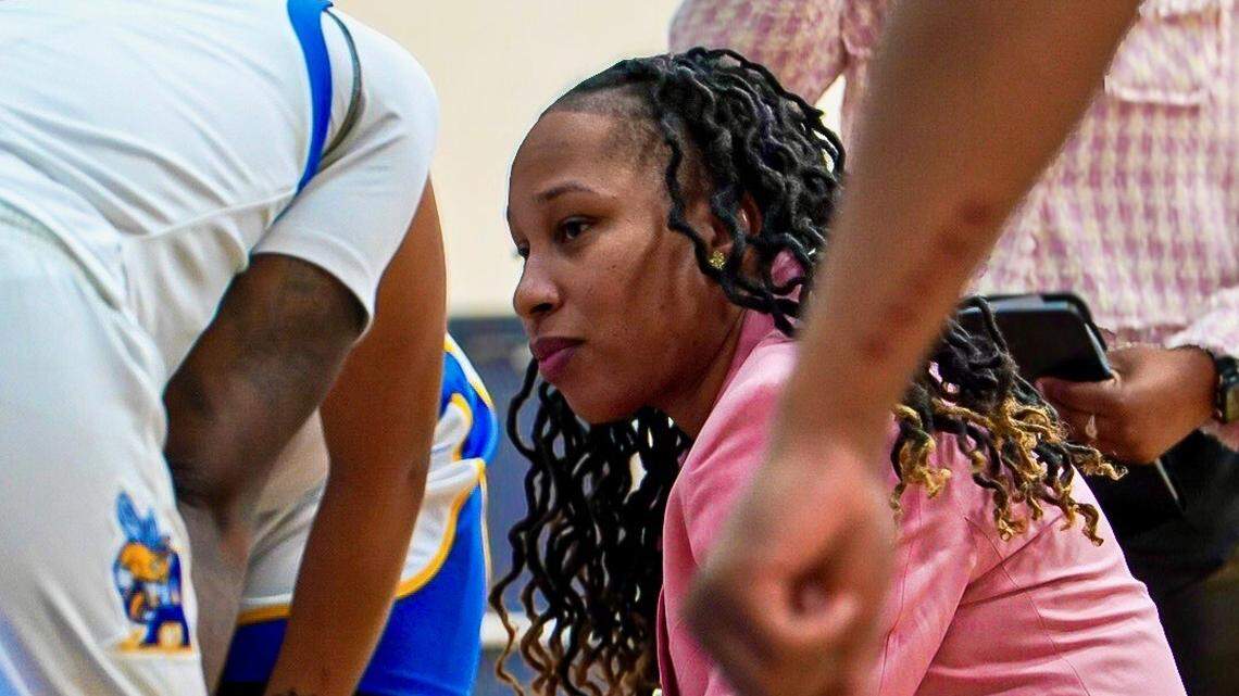 Allen University head women’s basketball coach Olivia Gaines in a team huddle on the sideline.
