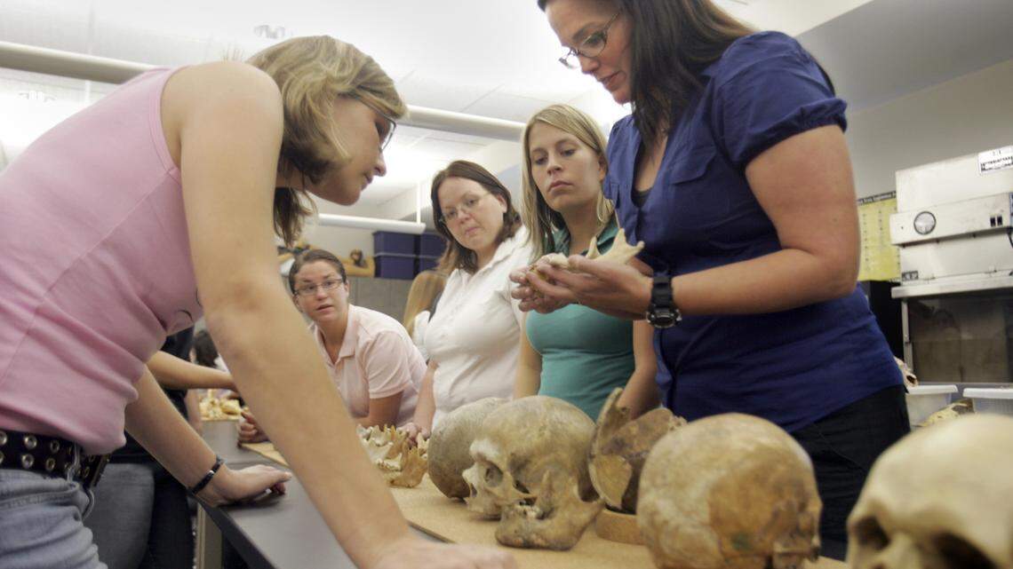 In this 2007 file photo, Dr. Heather Walsh-Haney, far right, a forensic anthropologist, teaches students.