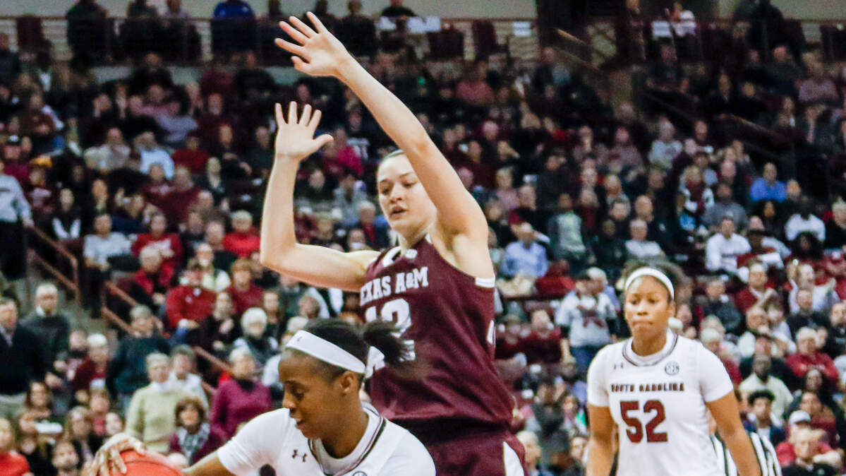 South Carolina's Doniyah Cliney (4) passes around defending Texas A&M's Danni Williams (12) during the second half of action in the Colonial Life Arena.USC won, 61-59 12/31/17