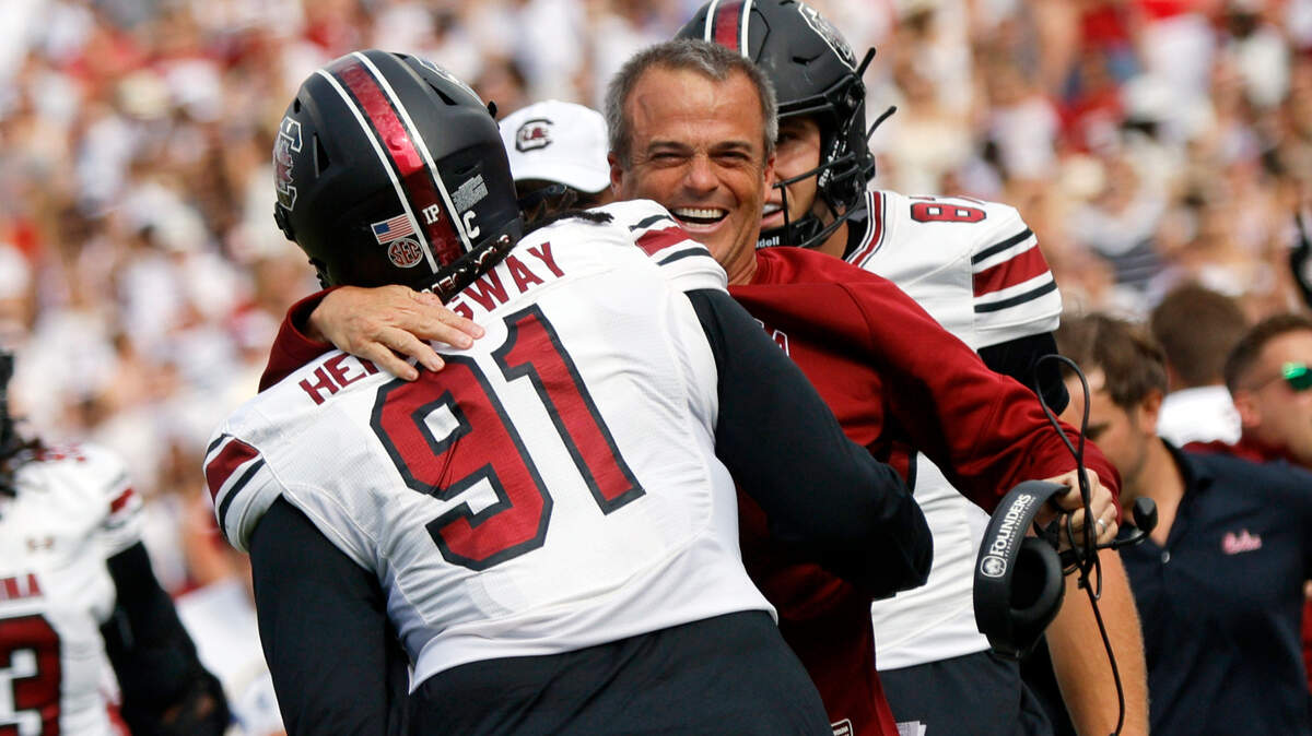 South Carolina head coach Shane Beamer hugs Tonka Hemingway (91) after Hemingway returned an Oklahoma fumble for a touchdown in the first quarter, Saturday, Oct. 19, 2024, at Gaylord Family - Oklahoma Memorial Stadium in Norman, Okla.