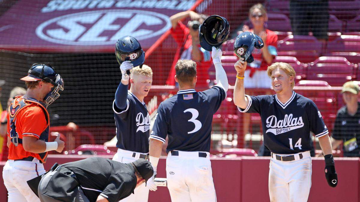 Teammates celebrate after Jackson Glenn’s two-run home run in the frist inning Saturday against Virginia. The teams faced off in Game 1 of the best-of-three series in the NCAA tournament’s Columbia Super Regional, held at Founders Park.