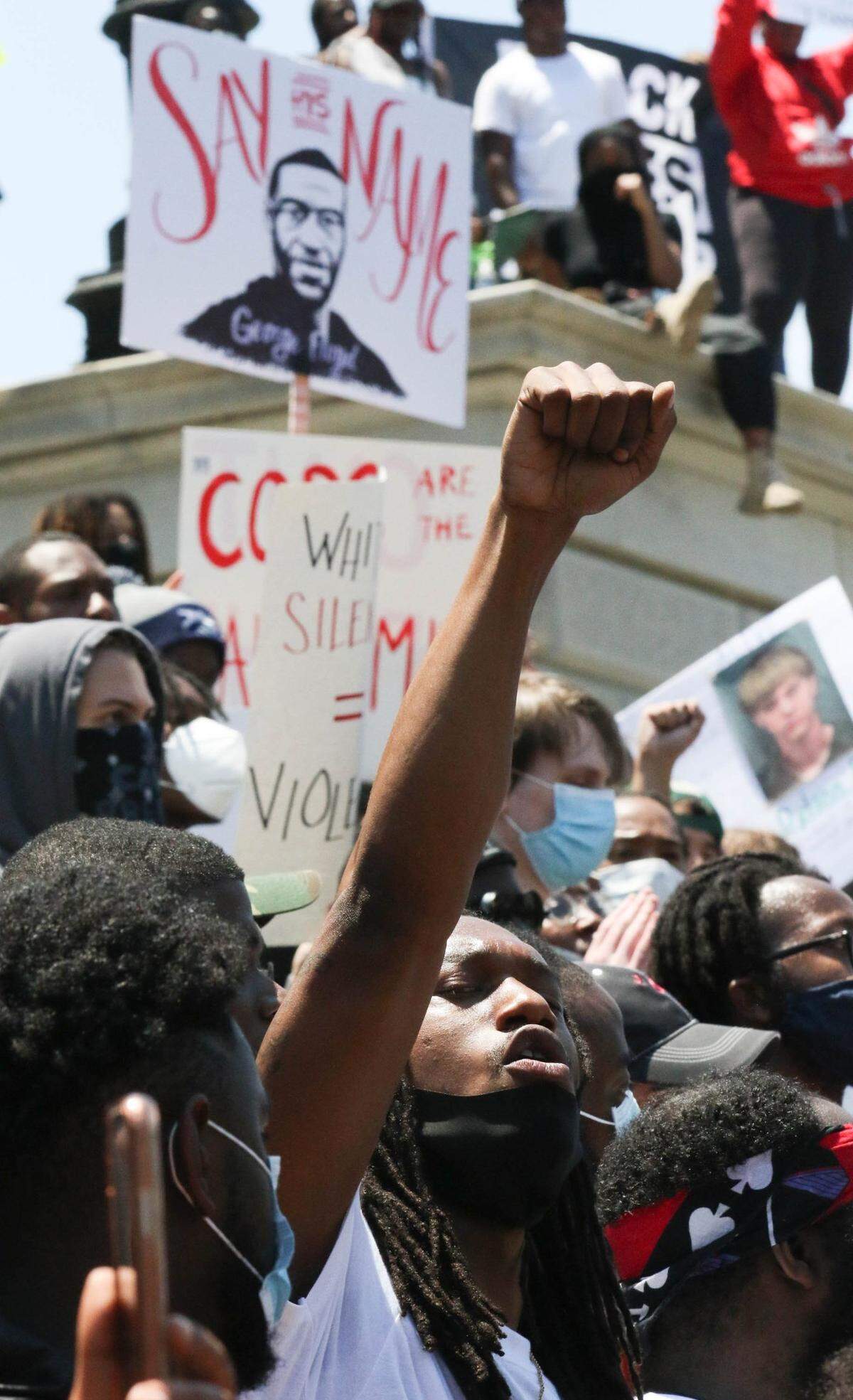 People demonstrate at the South Carolina Statehouse to protest the killing of George Floyd in Minneapolis. The peaceful rally turned into a violent protest as agitators dominated the gathering, smashing windows and burning police cars.