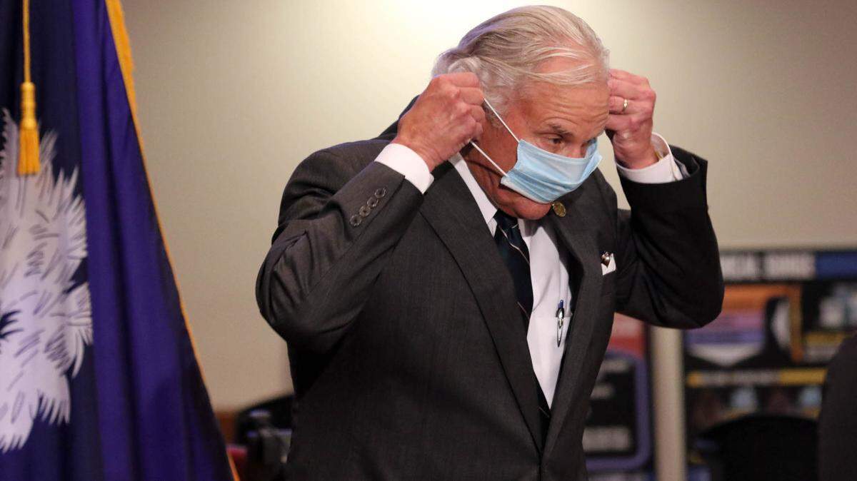SC Governor Henry McMaster puts on a mask after speaking during a press conference at the South Carolina Emergency Management Division. 7/29/20