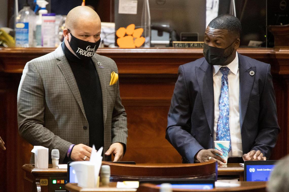State Rep. John King D-York, speaks with Rep. Kambrell Garvin D-Richland, at the South Carolina State House on Thursday, December 2, 2021.