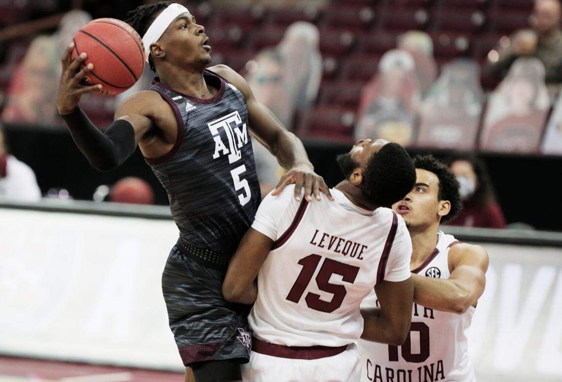 Texas A&M Aggies forward Emanuel Miller (5) jumps above South Carolina Gamecocks forward Wildens Leveque (15) at Colonial Life Arena on Wednesday, January 6, 2021.