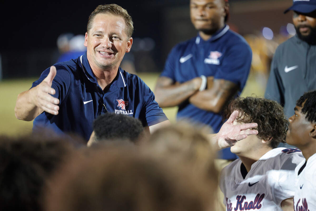 White Knoll’s Nick Pelham talks to his team after beating Lexington on Friday, October 13, 2023.