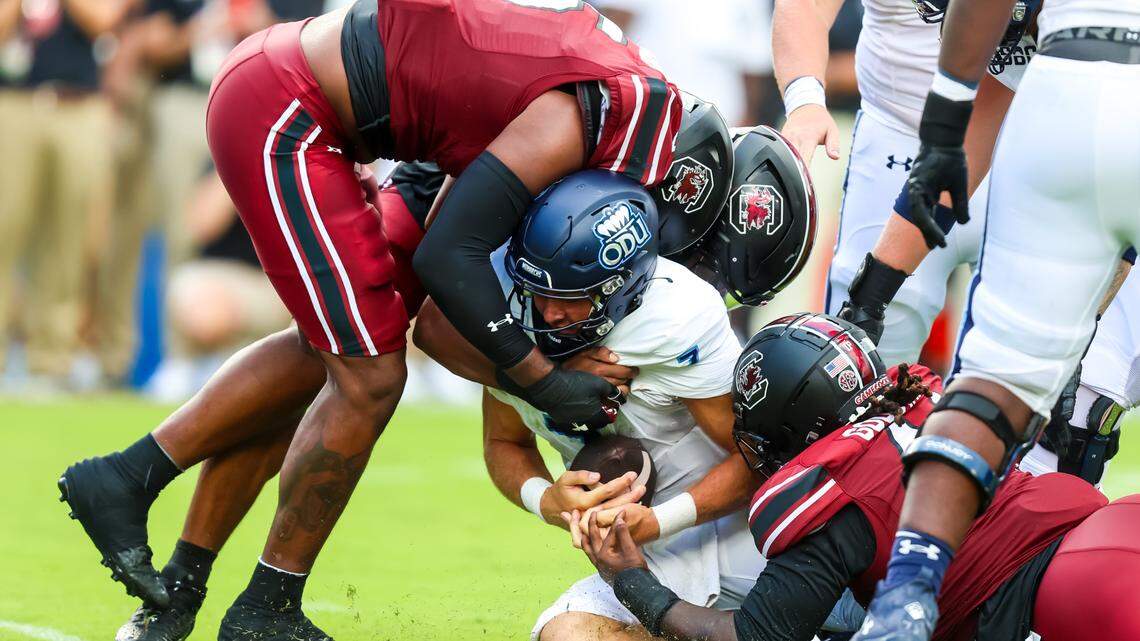 Aug 31, 2024; Columbia, South Carolina, USA; Old Dominion Monarchs quarterback Grant Wilson (7) is sacked by South Carolina Gamecocks edge Dylan Stewart (6) in the second quarter at Williams-Brice Stadium.