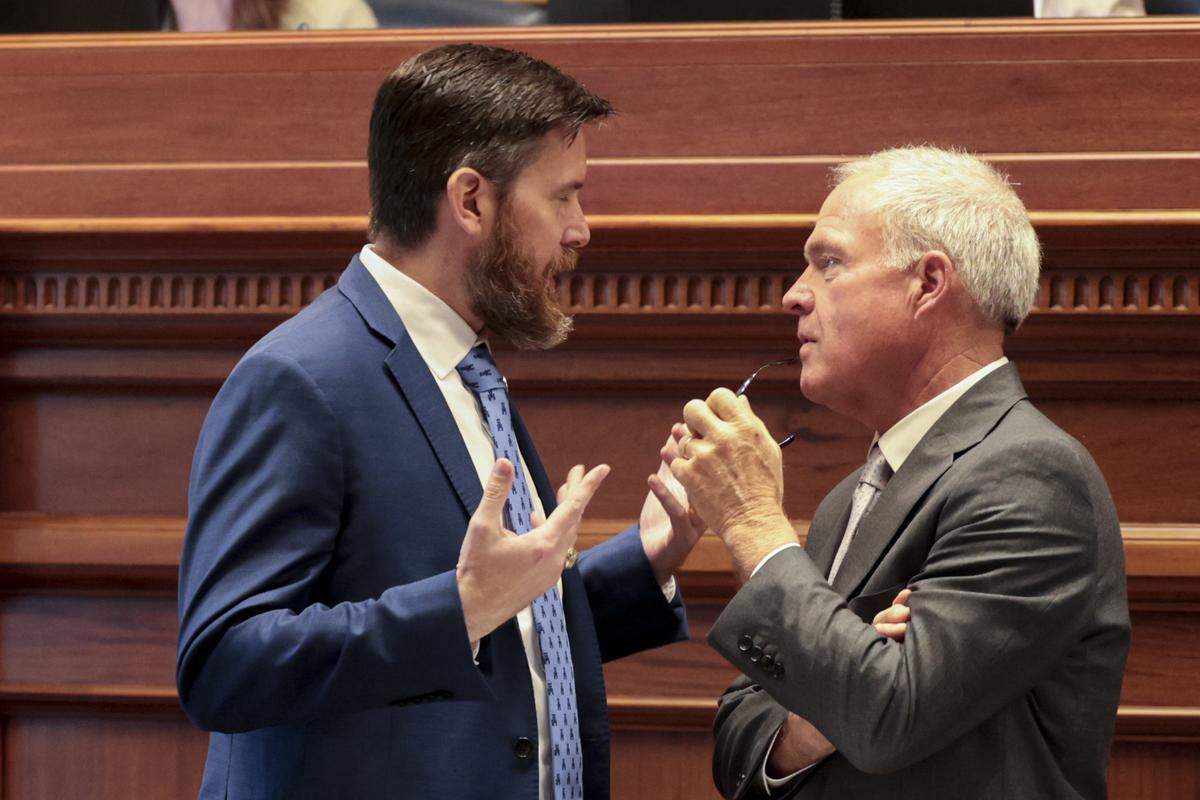 Sen. Ed Sutton, left, and Sen. Danny Verdin speak in the Senate Chambers on Tuesday, April 14, 2026.