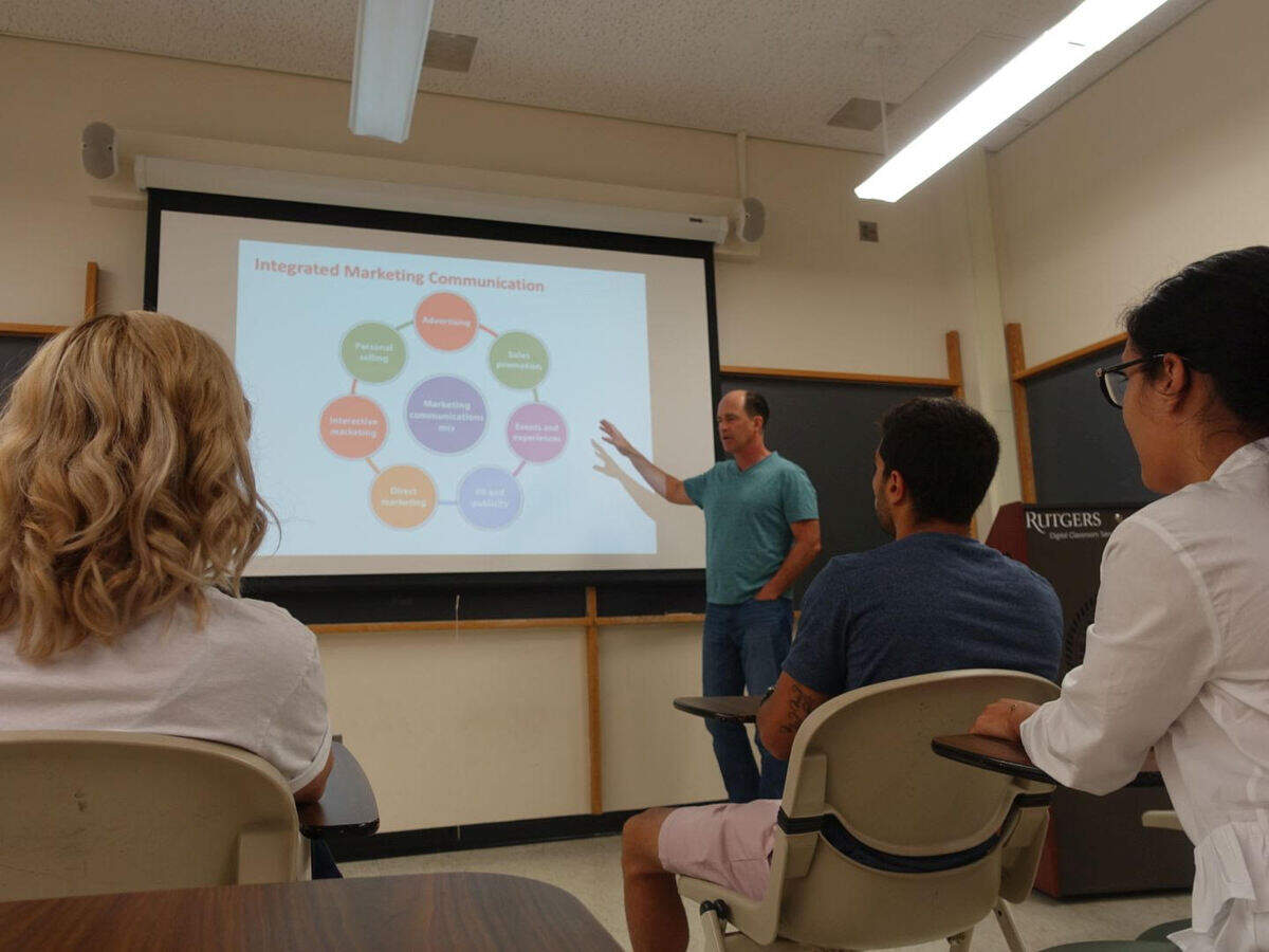 Mark Beal teaches a marketing class at Rutgers University. Beal recently published an advice book for college freshmen featuring writing from a USC alumna.
