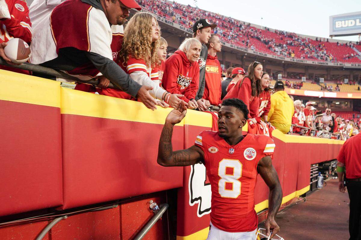 Oct 12, 2023; Kansas City, Missouri, USA; Kansas City Chiefs wide receiver Justyn Ross (8) celebrates with fans while leaving the game after the win over the Los Angeles Chargers at GEHA Field at Arrowhead Stadium.